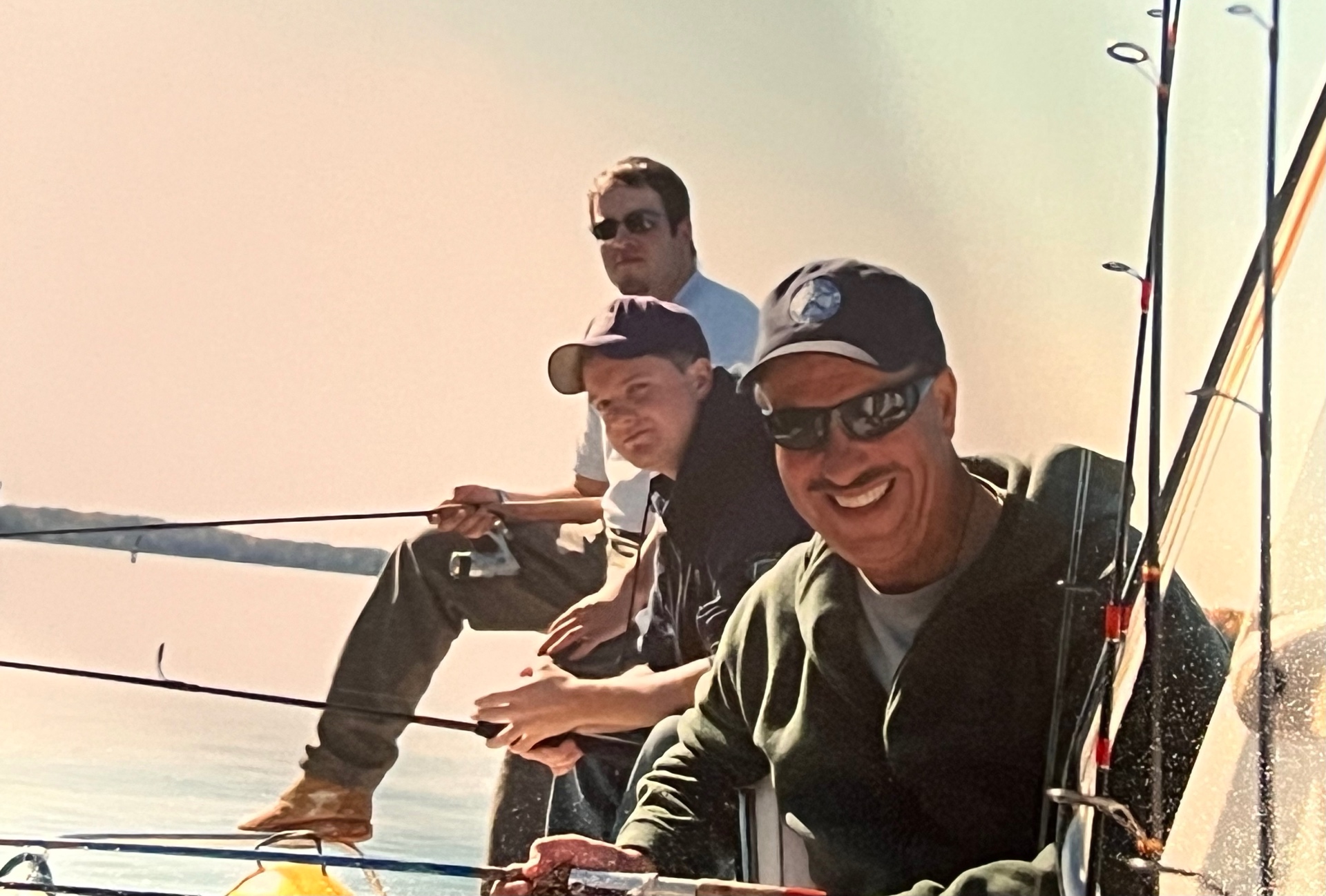 Richard front and center with that trademark smile — the boys behind him, rods lined up against the sky