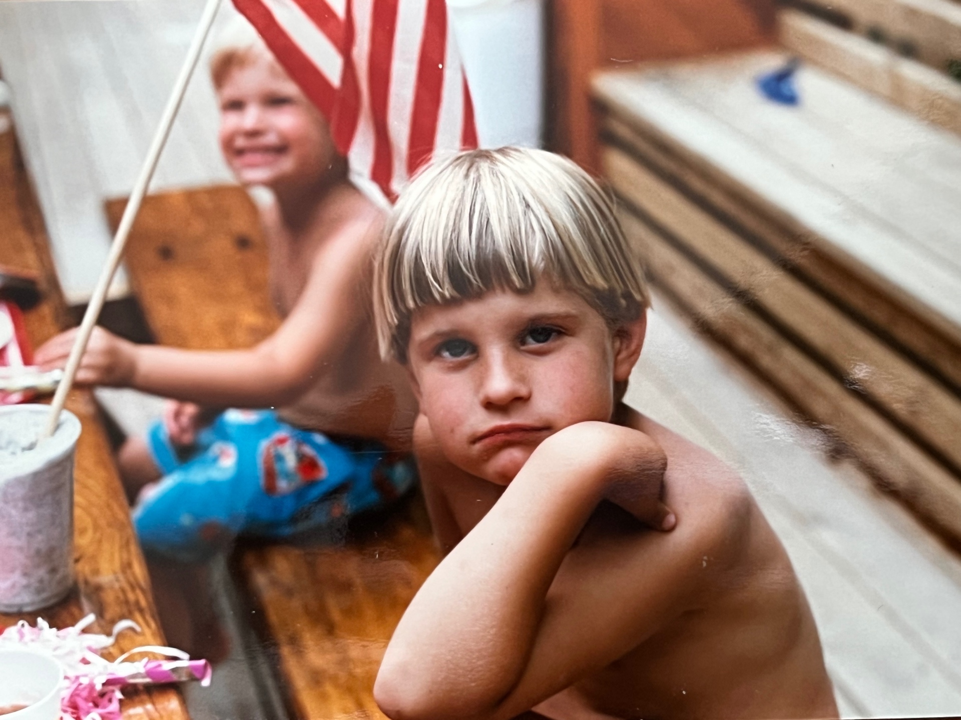 Fourth of July with the boys — flags up, faces sun-kissed, summer at its purest