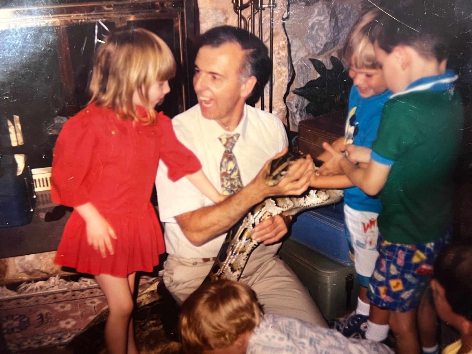 Wide eyes and a python across his lap — the birthday Jason still talks about. Richard, the best father in the world, made it real