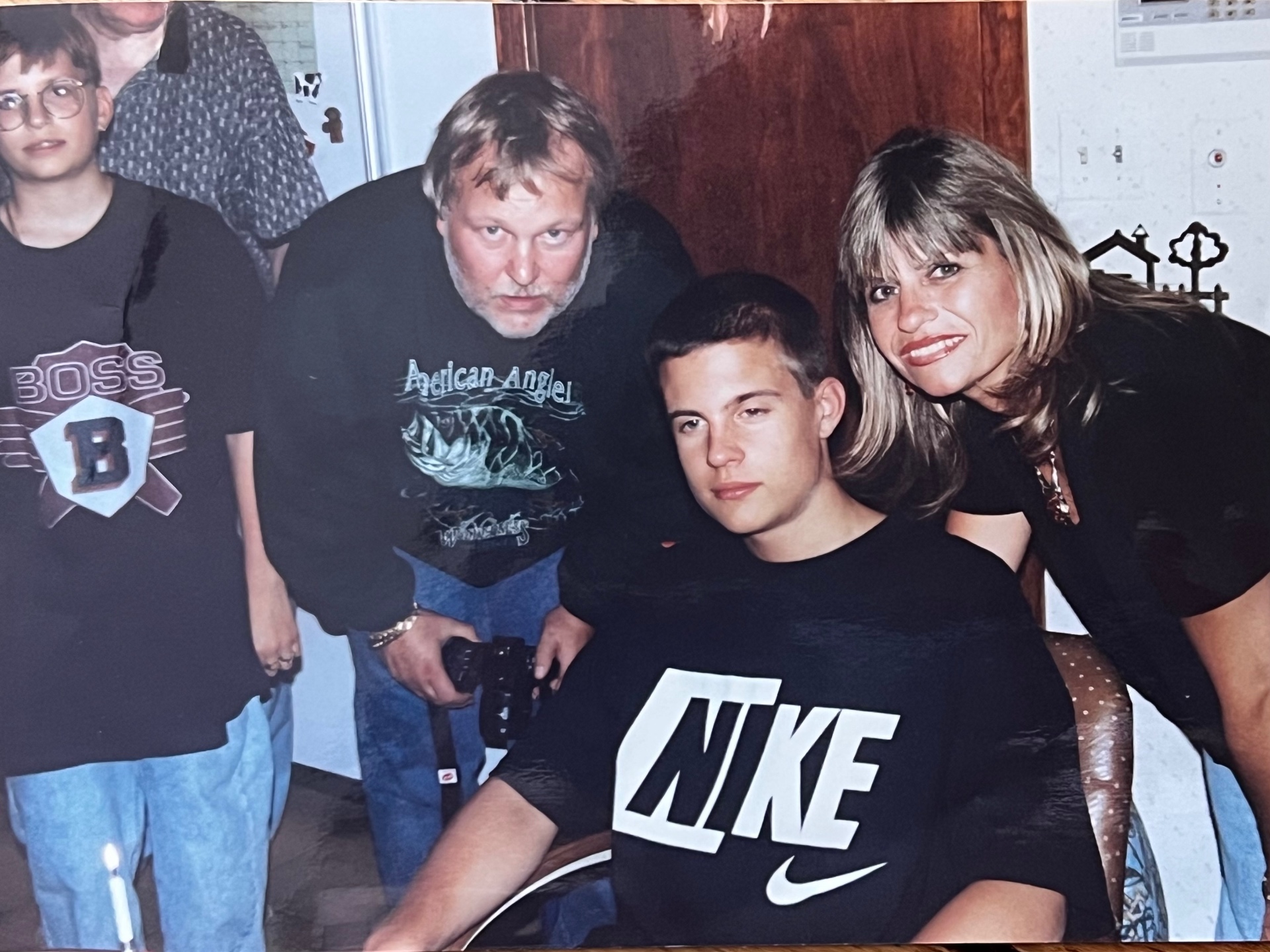 Richard, Yvonne, and their boy — camera in hand, family close, exactly where he wanted to be