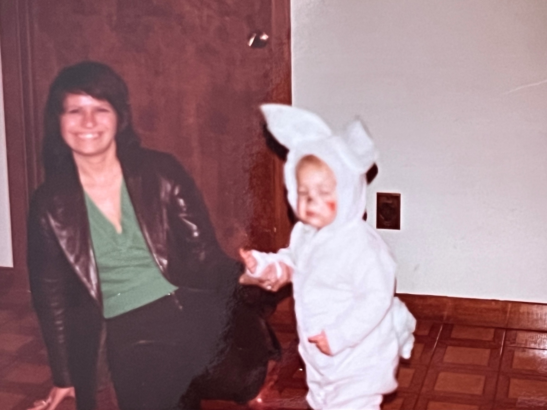 Yvonne beside a little one in costume — one of those tender family moments that stays with you