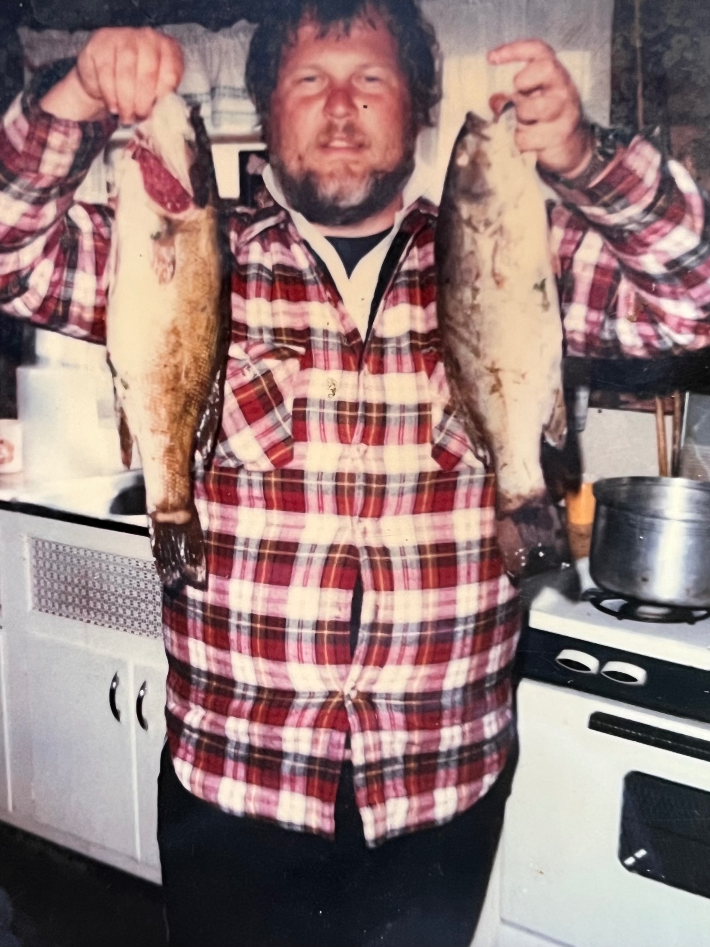 Two beauties in one trip — Richard in his flannel, proud as ever, holding up the day's trophy catch