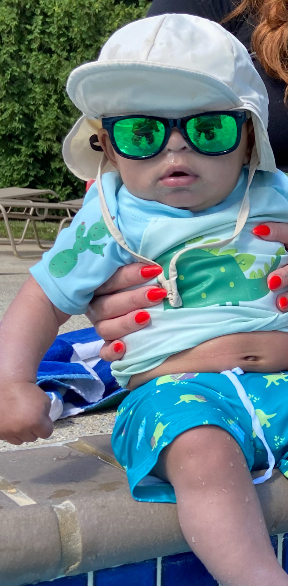 Easton poolside in shades — the coolest little guy in the family
