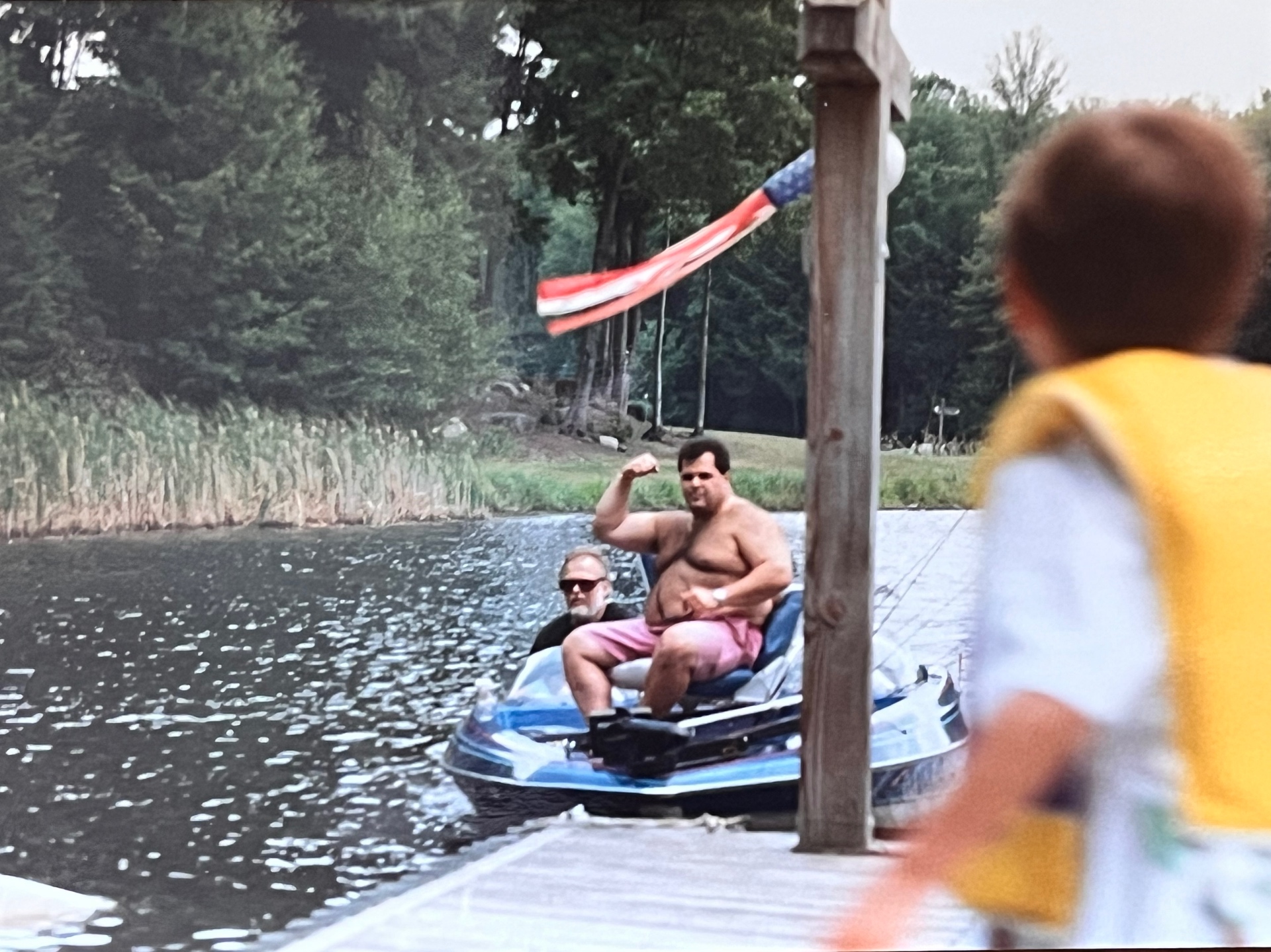 King of the lake — flexing on the jet ski while the little one watches in awe