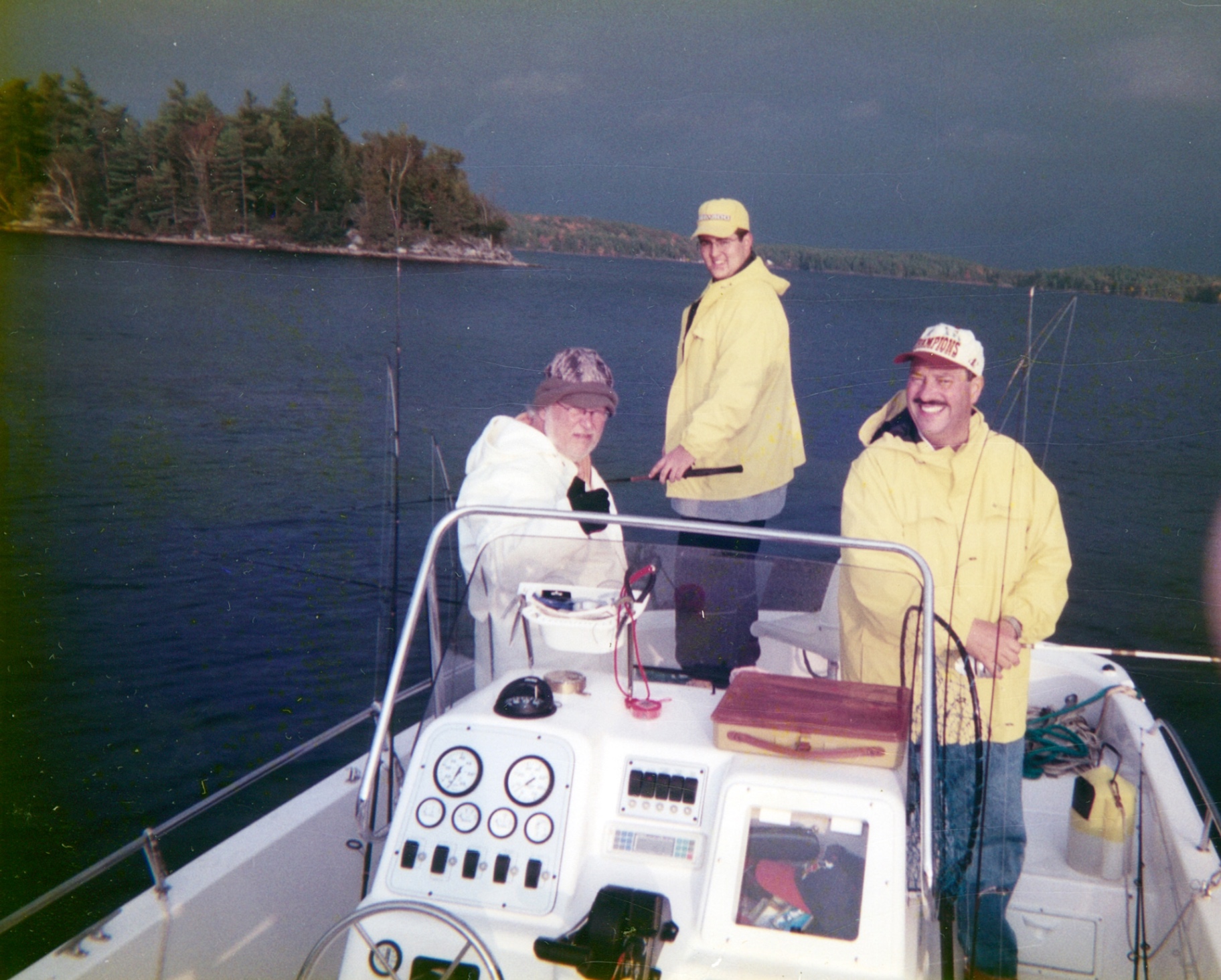 The Canada crew — Richard, Bob, and the friends he met along the journey. Yellow slickers, stormy skies, endless stories