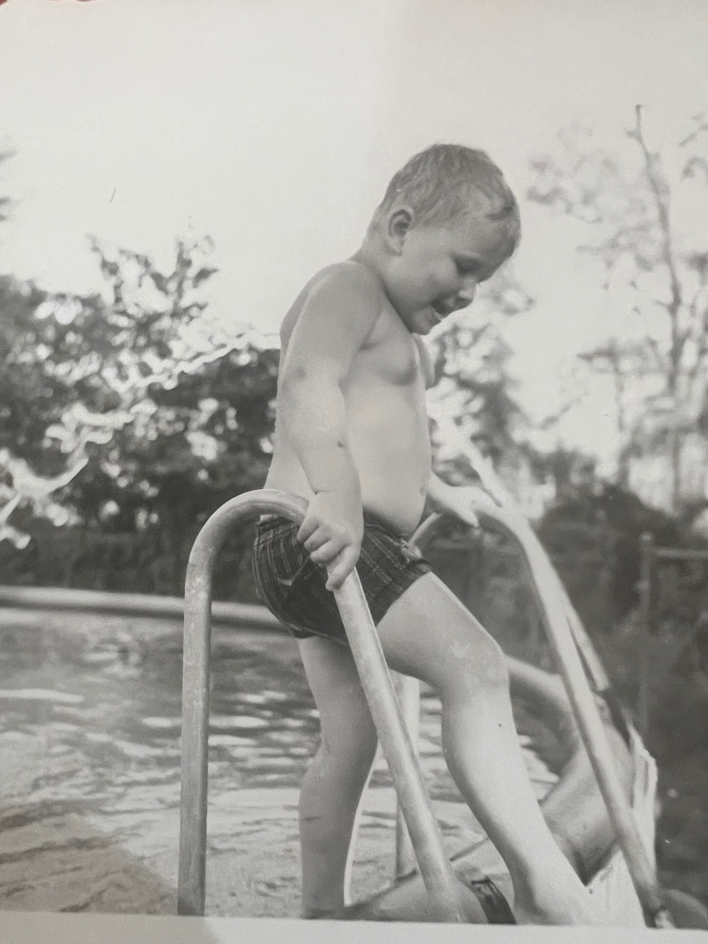 Climbing out of the pool, grinning ear to ear