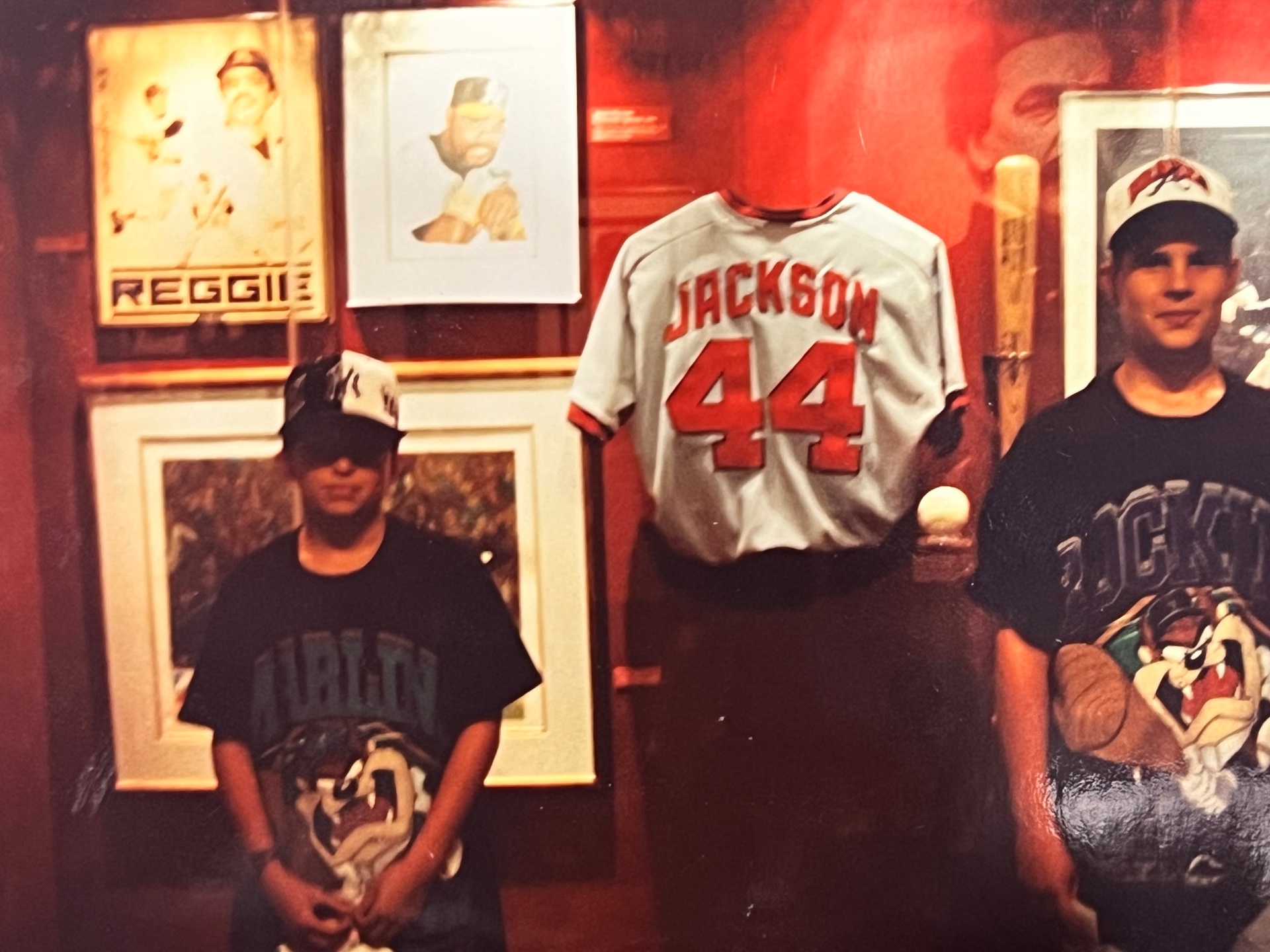 Jason and Chris in front of the Reggie Jackson #44 jersey — 'Hey Jackson.' 'What's up, Jack.' The nickname Richard and Jason called each other, for life