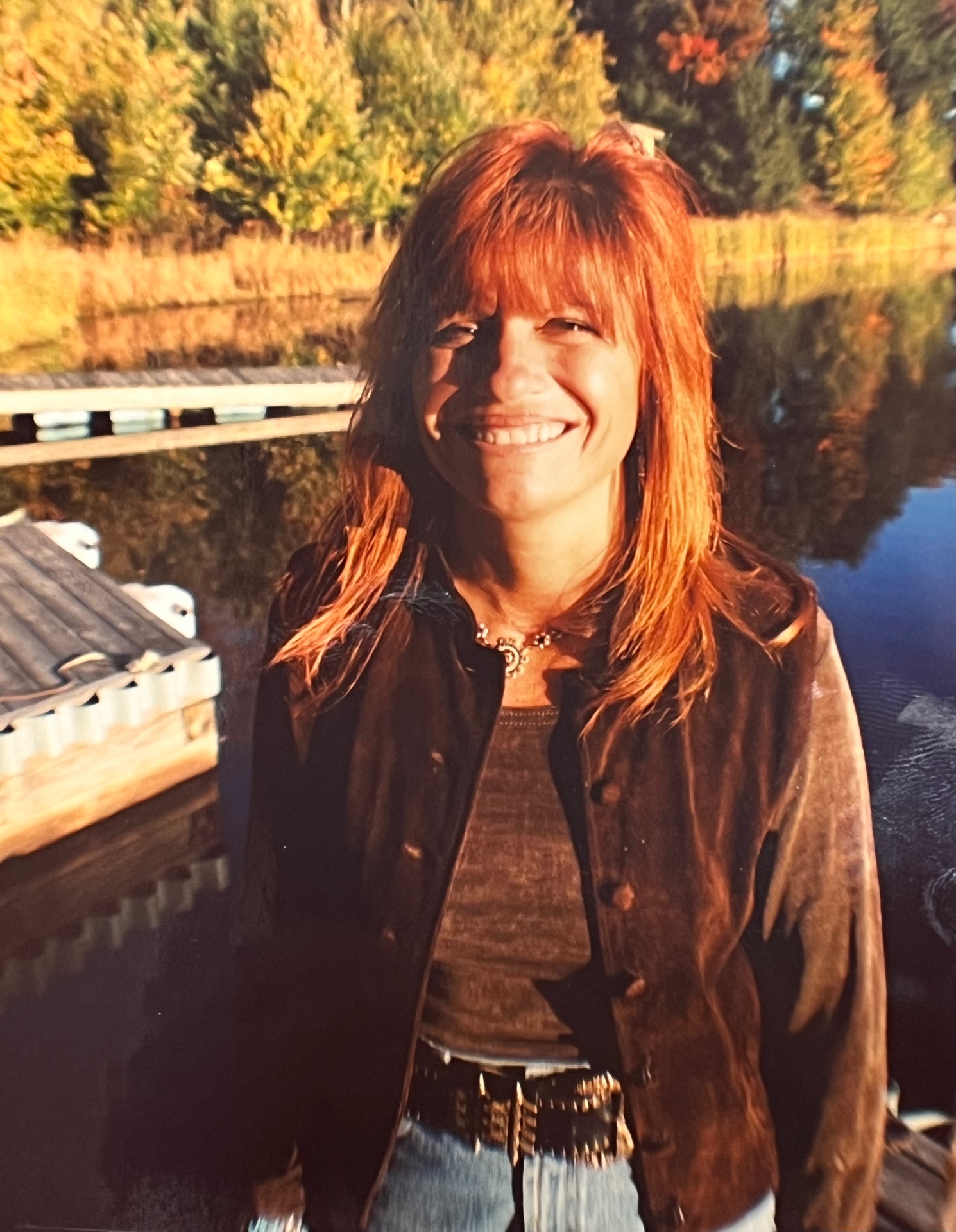 Yvonne on the dock — golden hour at The Hideout, that unforgettable smile