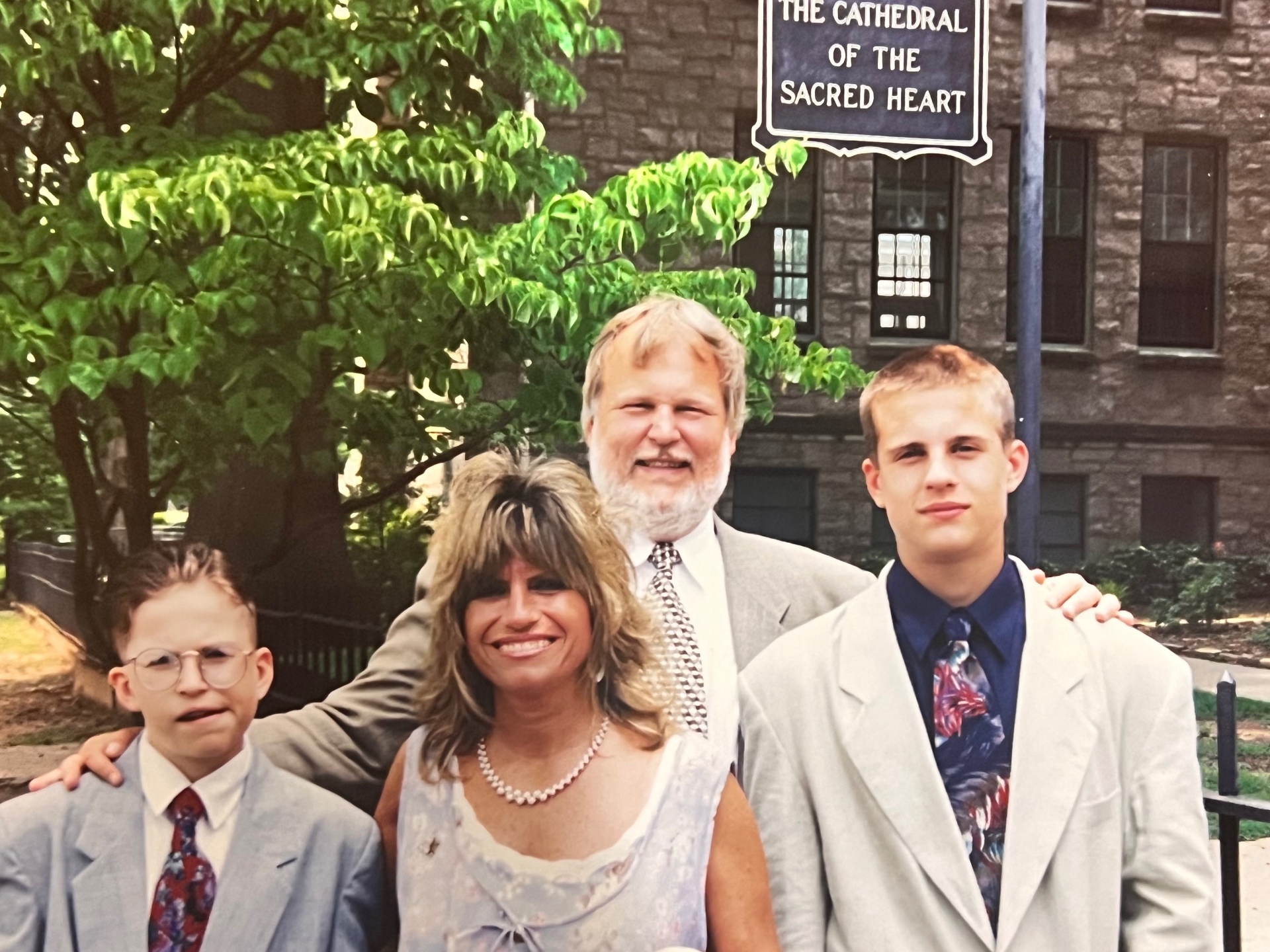 The Bladis family at the Cathedral of the Sacred Heart — Richard, Yvonne, and the boys dressed up for a milestone day