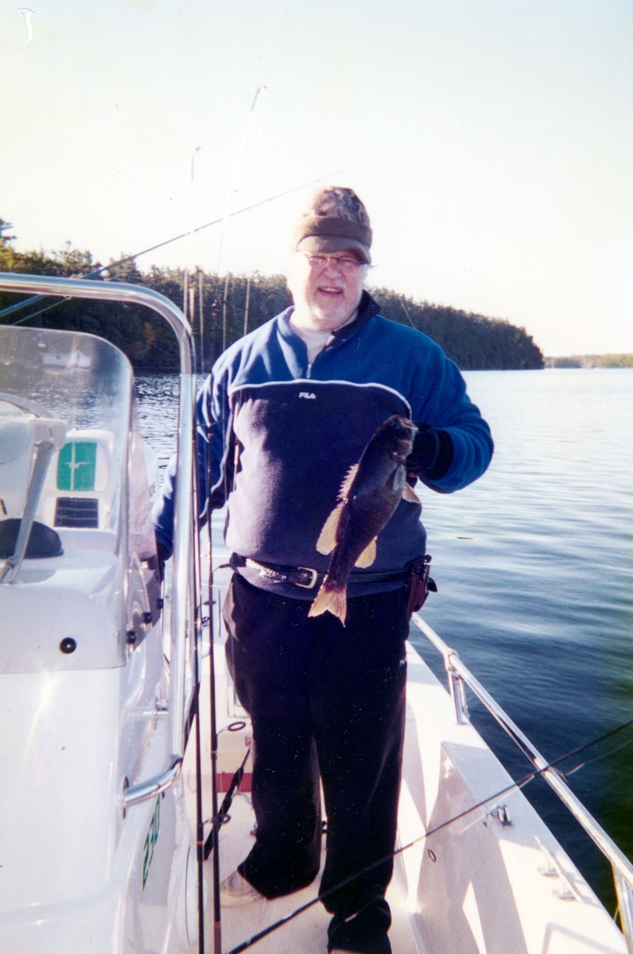 Another one landed — quiet pride on a crisp Canada morning, the boat rigged and ready