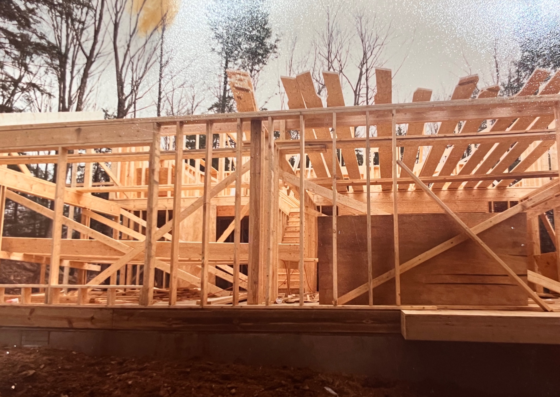 Winter framing days, 1986 — the bones of The Hideout going up stud by stud
