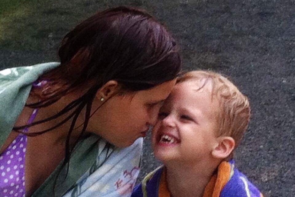 Forehead to forehead with mom — Sean laughing the way only he could
