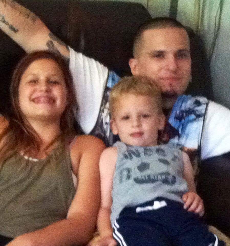 Malayna and Sean piled on the couch with Dad — the coziest kind of afternoon
