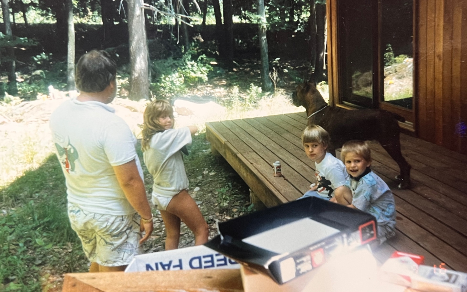 Family friends and the kids gathered by the deck — the kind of afternoon that made The Hideout home